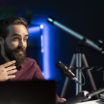 man using professional recording equipment to film vlog channel intro for internet platforms